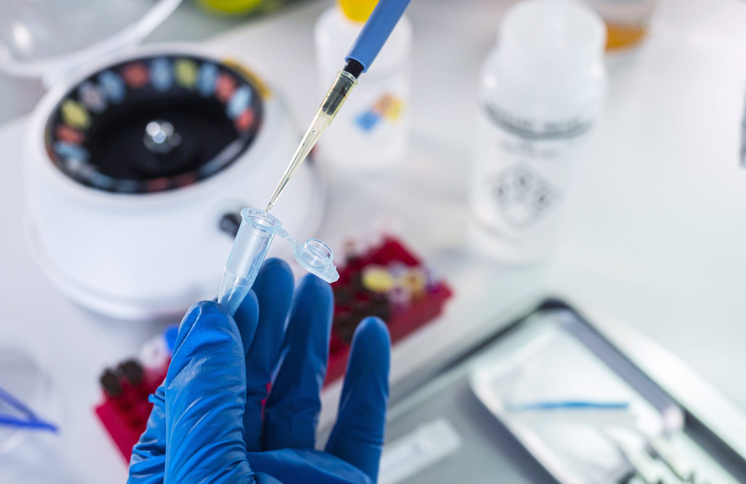police-scientist-prepares-vial-for-crime-lab-analy-2021-10-04-21-18-49-utc-min
