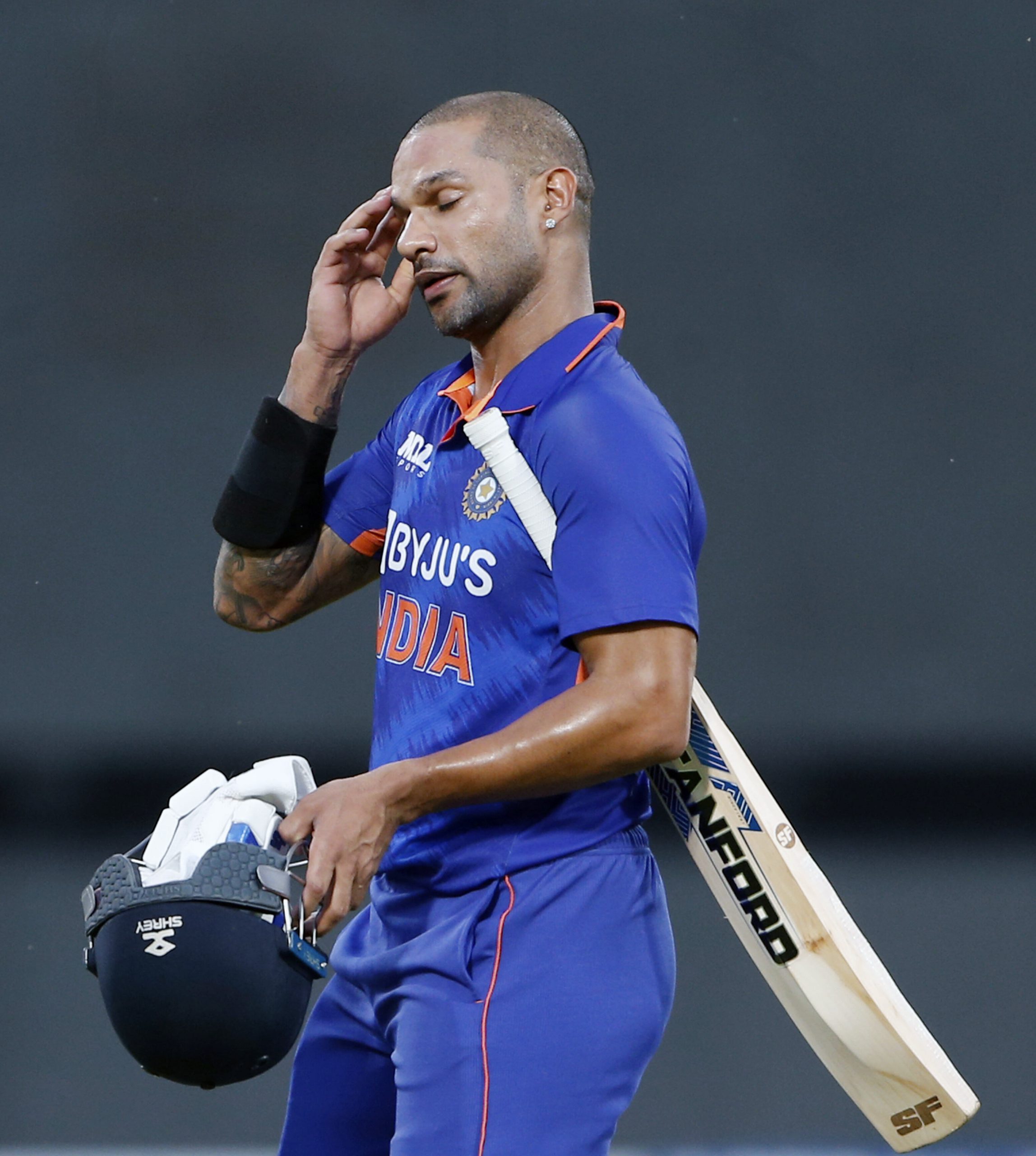 Indian skipper Shikhar Dhawan walks back to the pavilion after being dismissed