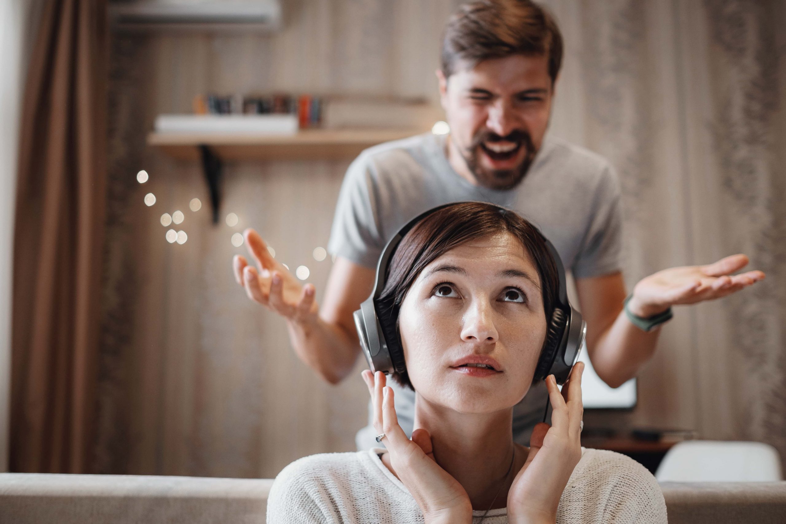 angry-husband-shouting-at-wife-sitting-on-sofa-and-2022-11-15-14-39-35-utc-min