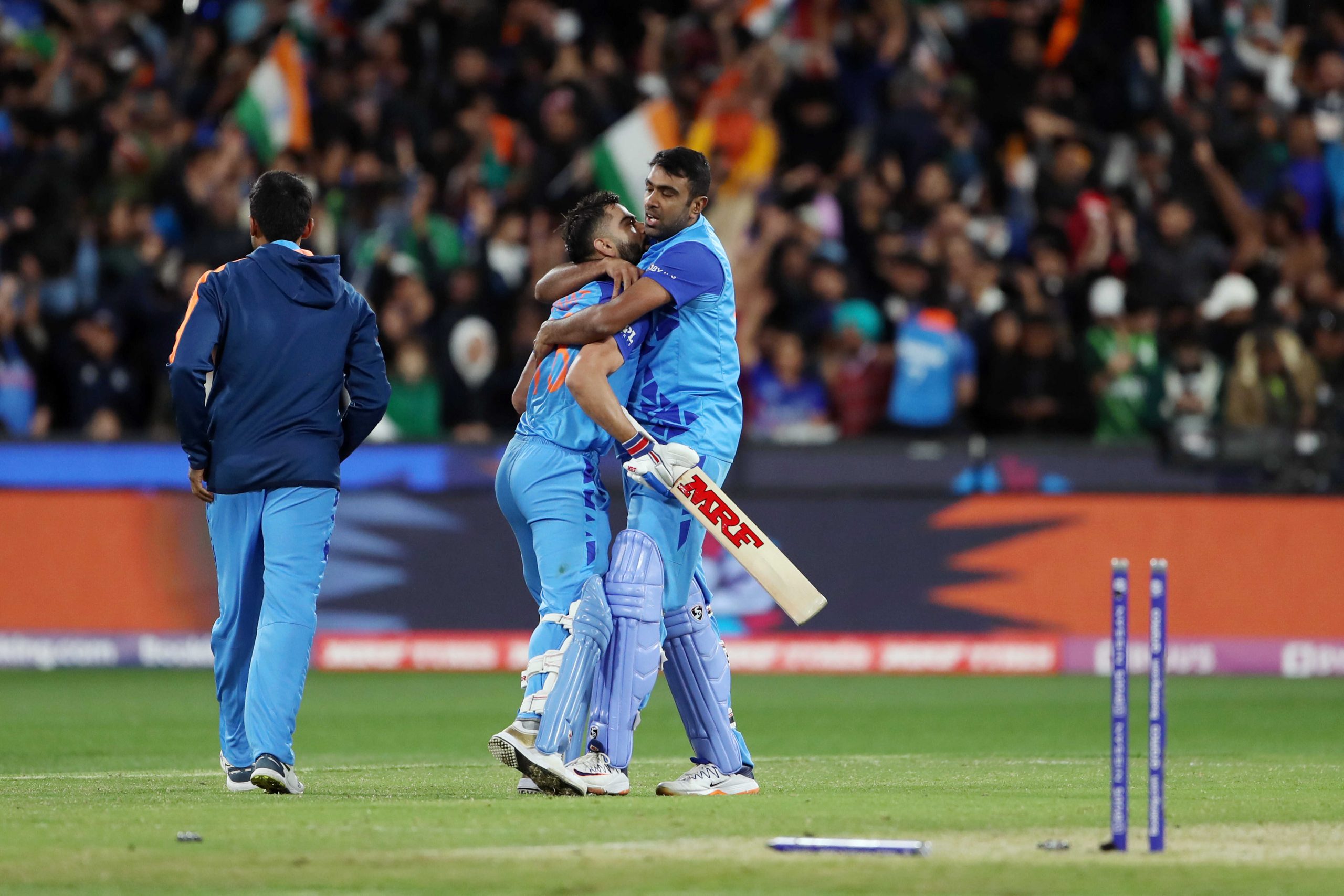 India's Ravichandran Ashwin and Virat Kohli celebrate after beating Pakistan by 4 wickets