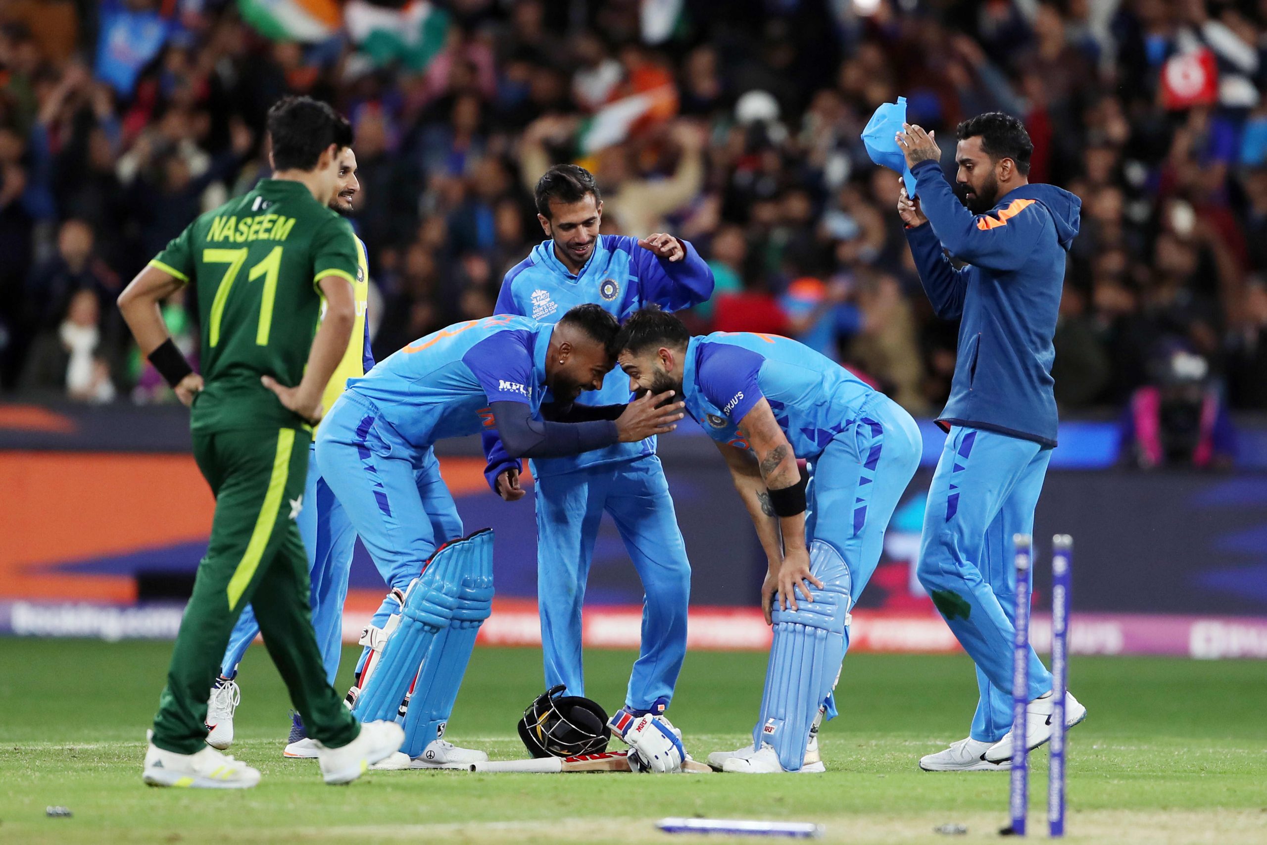 India's Virat Kohli and Hardik Pandya celebrate after beating Pakistan by 4 wickets