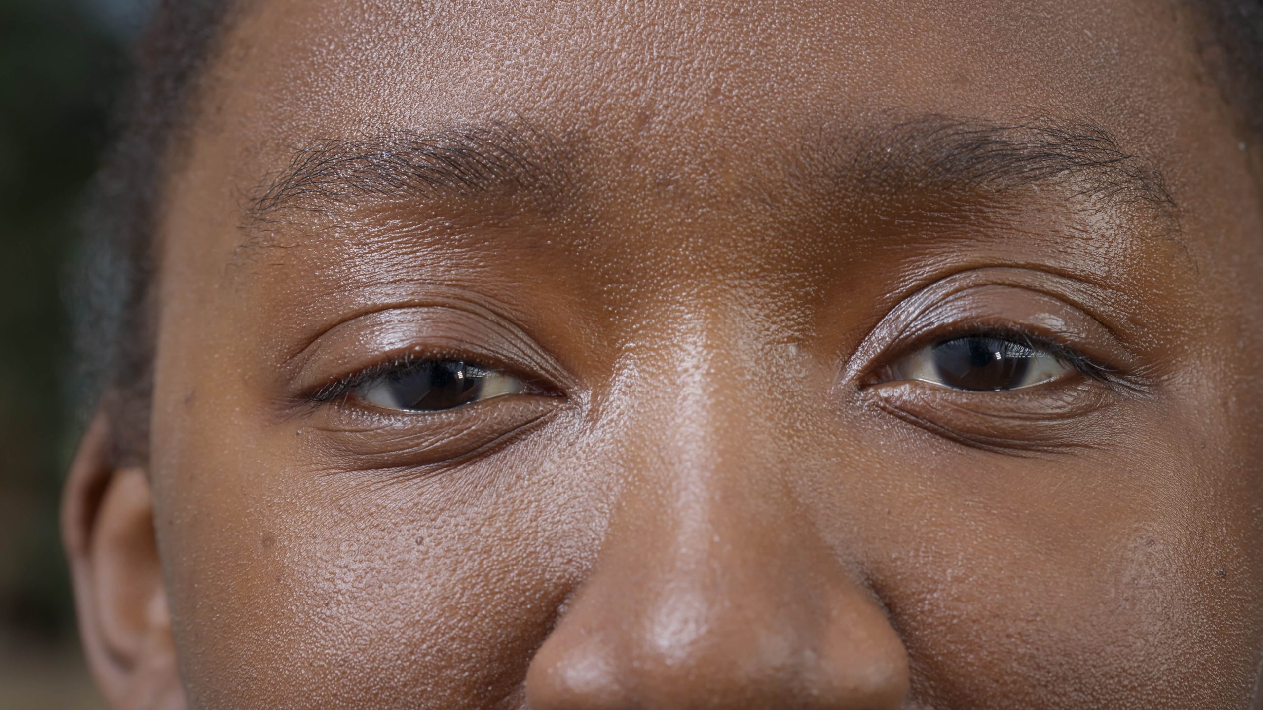 macro-shot-of-natural-woman-looking-at-camera-2022-03-18-15-50-24-utc-min