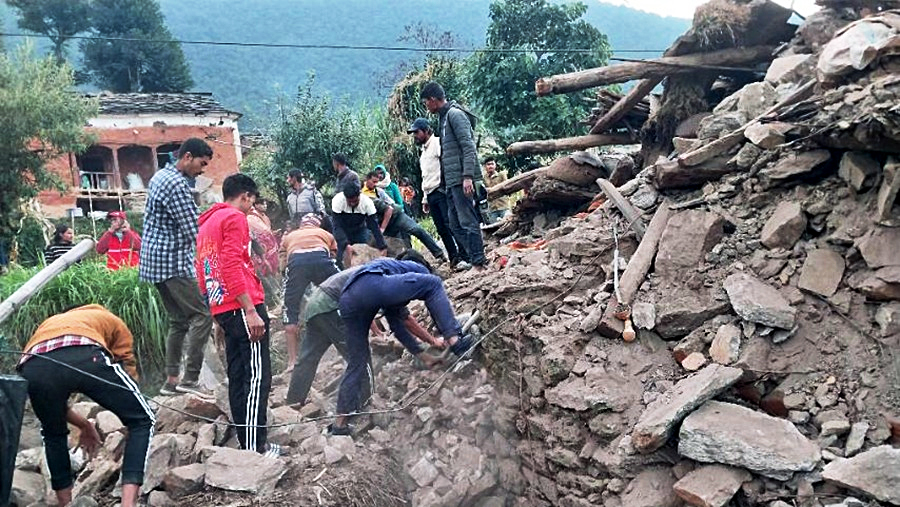 A search and rescue operation underway after buildings were reduced to debris